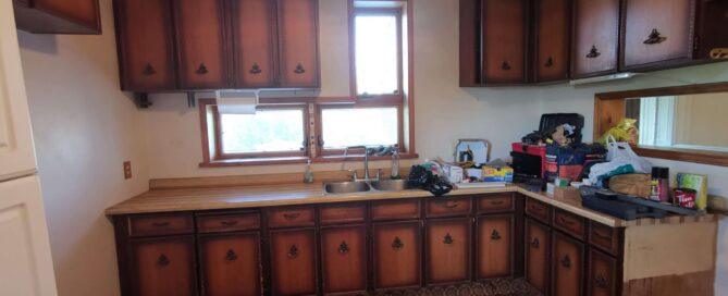 Dated kitchen with wooden cabinets
